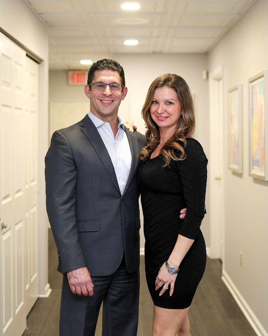 Dr. Tamburrino with a smiling patient in the practice lounge
