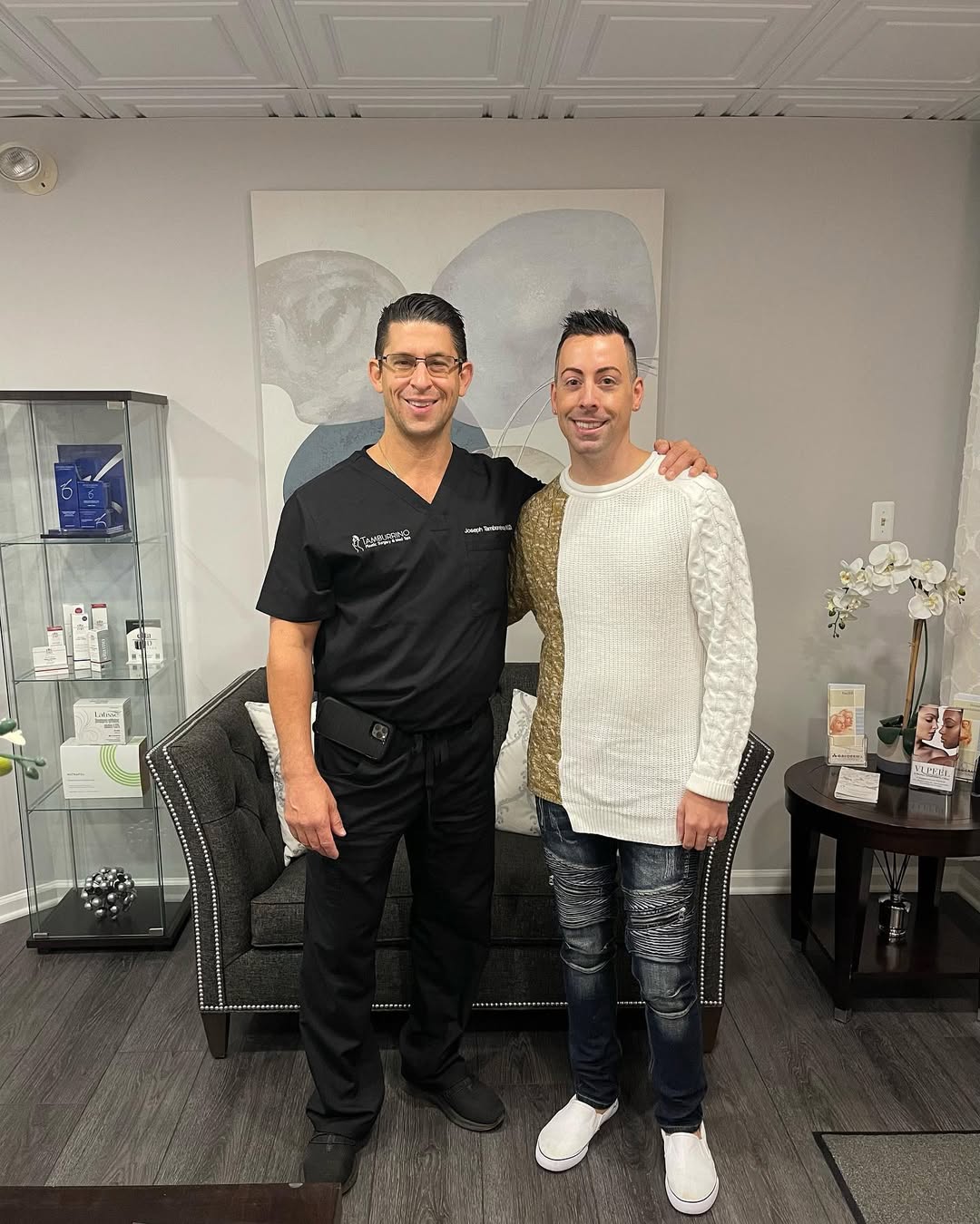 Dr. Tamburrino with a smiling patient in the practice lounge